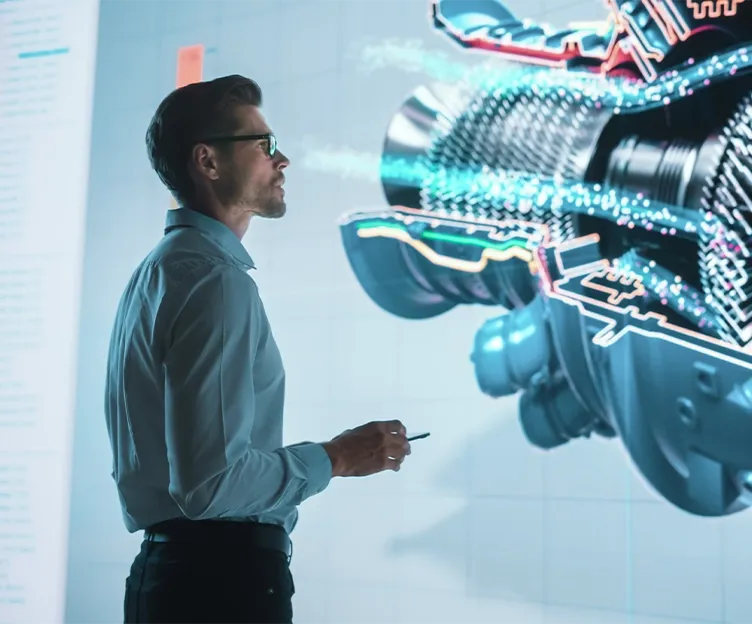 Image of energy engineer looking at a turbine rendering. Protection and controls.