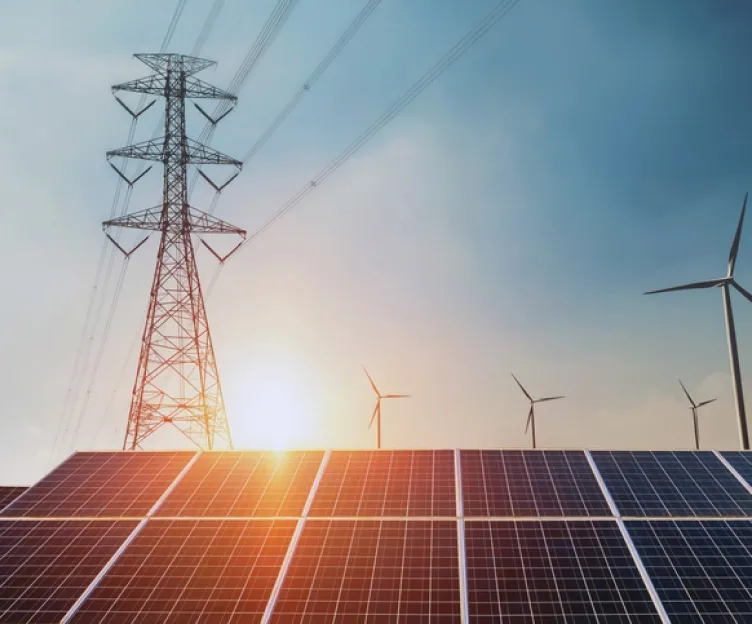 Image of transmission lines, wind turbines, and solar panels together. Planning interconnection operations integrated holistic planning.
