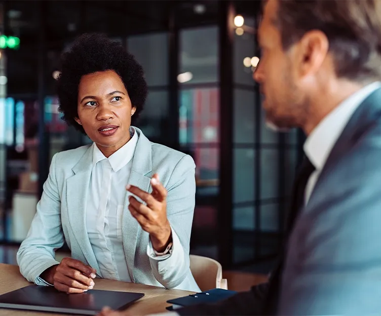 Image of two policy and regulatory experts discussing energy industry. Policy and regulatory, regulatory support.